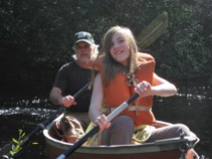 Iliana canoes with Grandpa